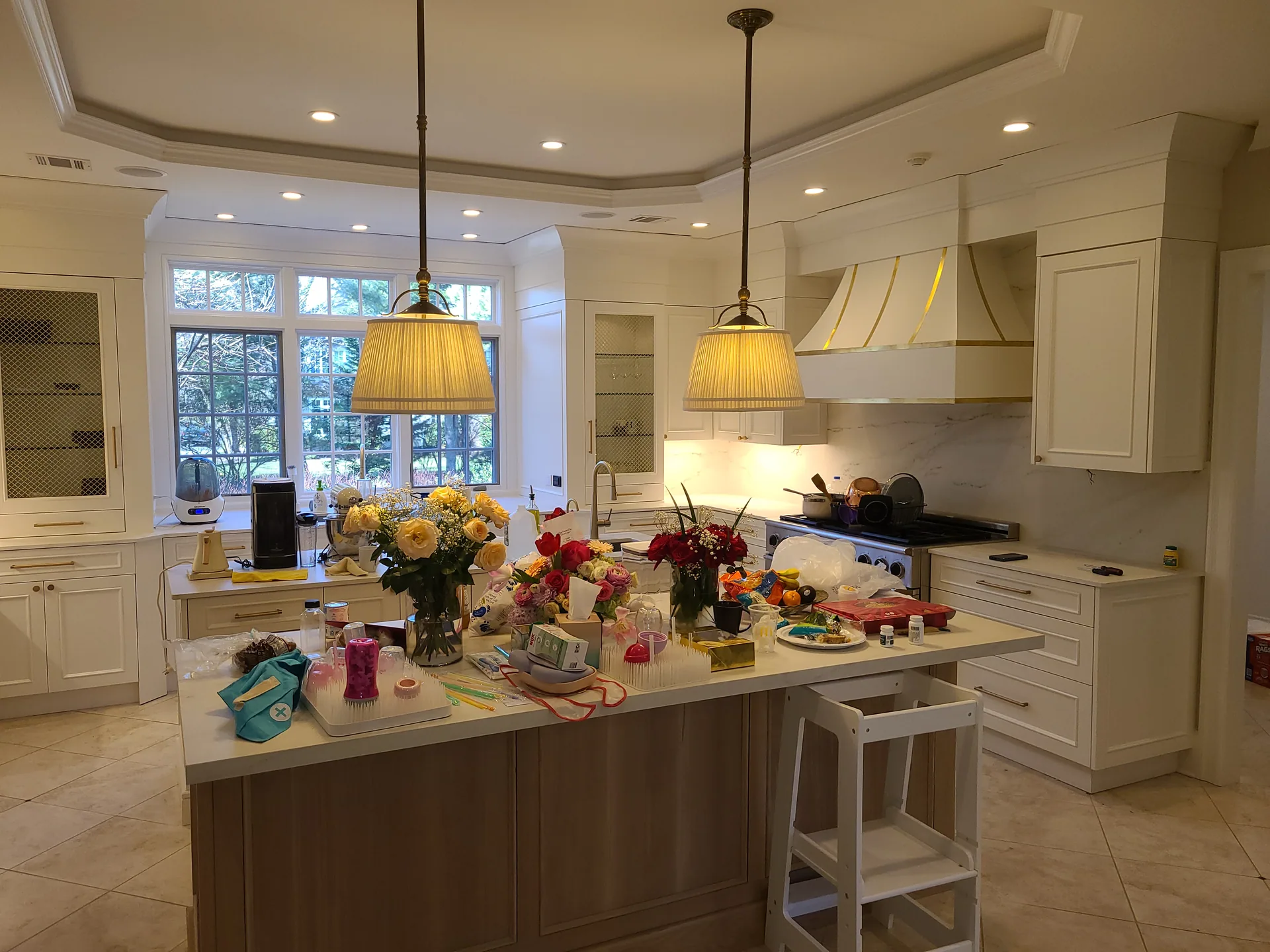 Coffered gourmet kitchen with custom range hood